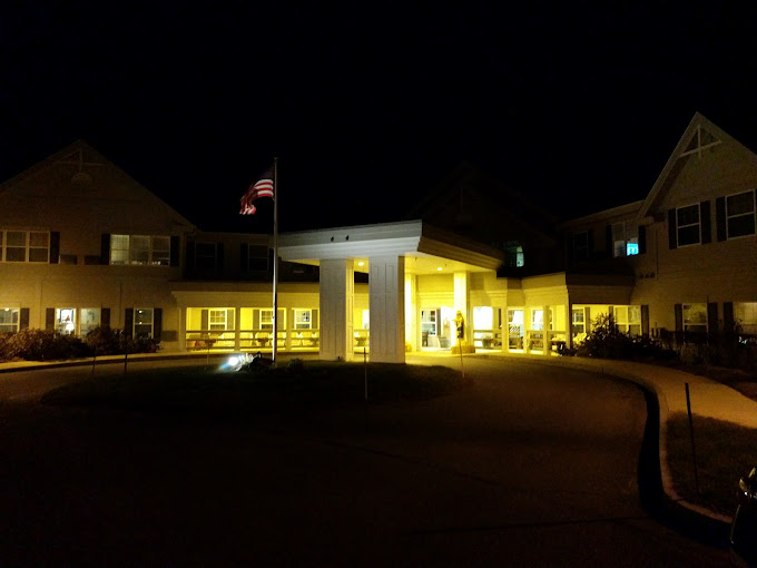 The outside of John H. Whitaker Place at night.